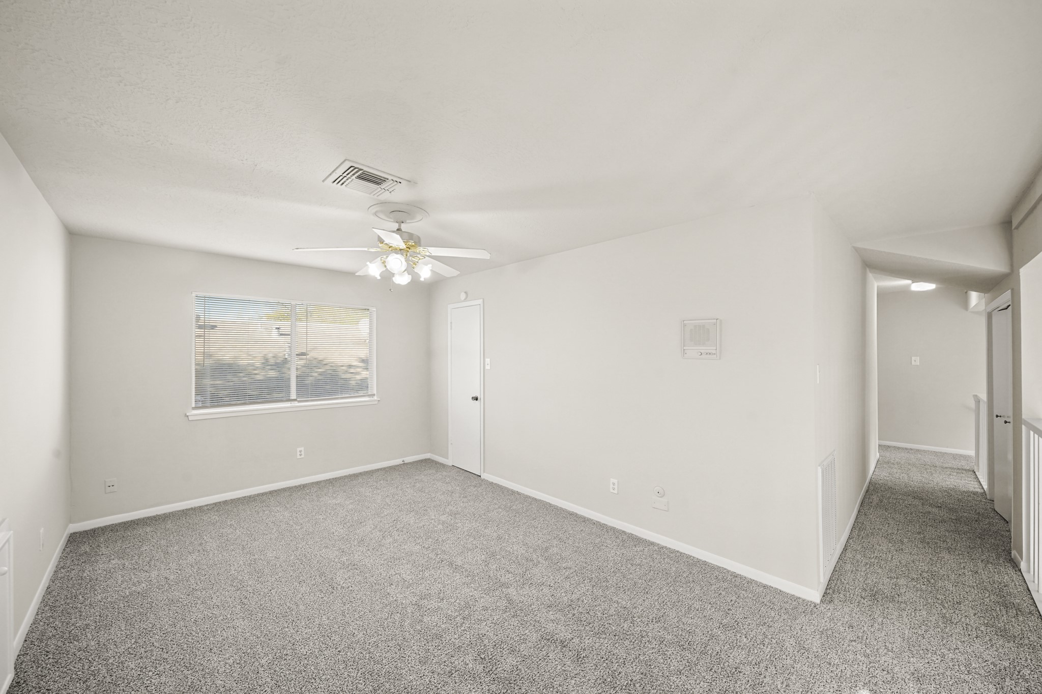 6514 Winkleman Road Houston, TX 77083 - Photo 11 of 15 an empty room with a ceiling fan and a window