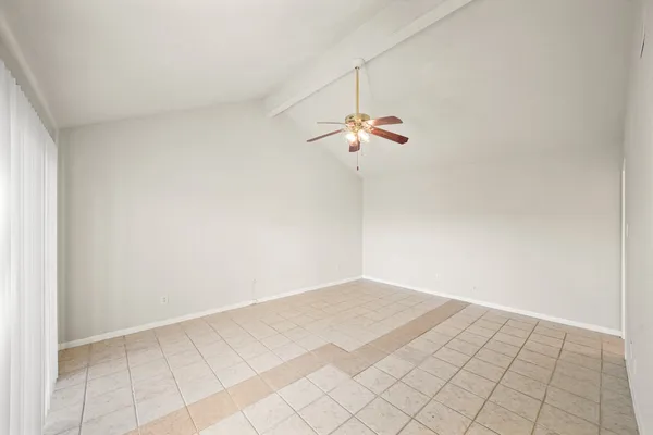 a view of a room with a hanging light