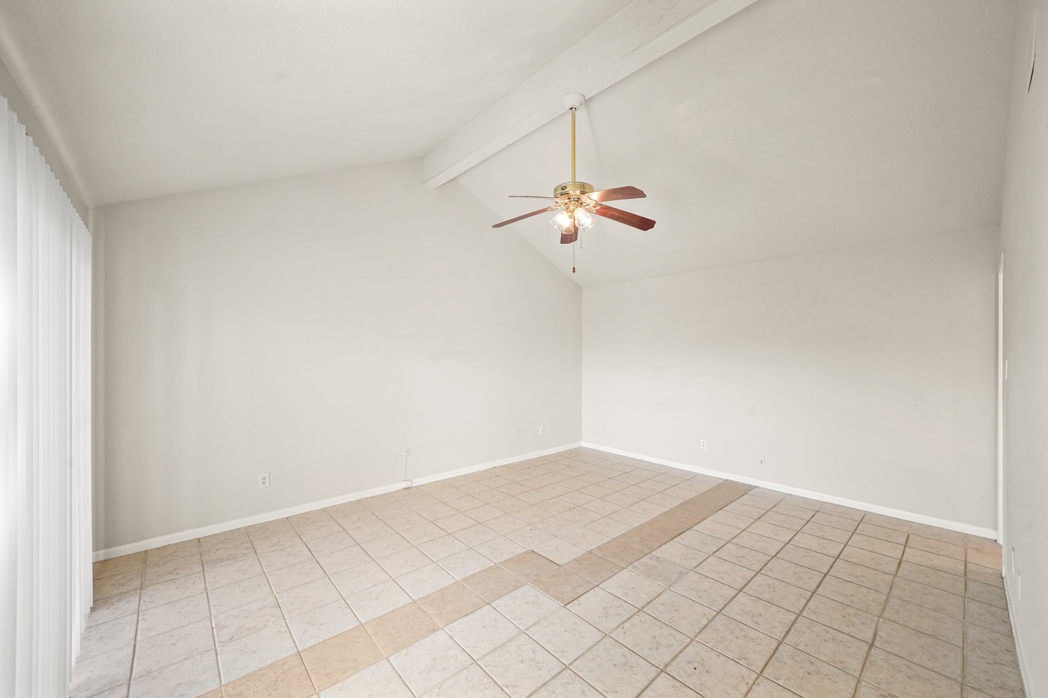 6514 Winkleman Road Houston, TX 77083 - Photo 6 of 15 a view of a room with a hanging light