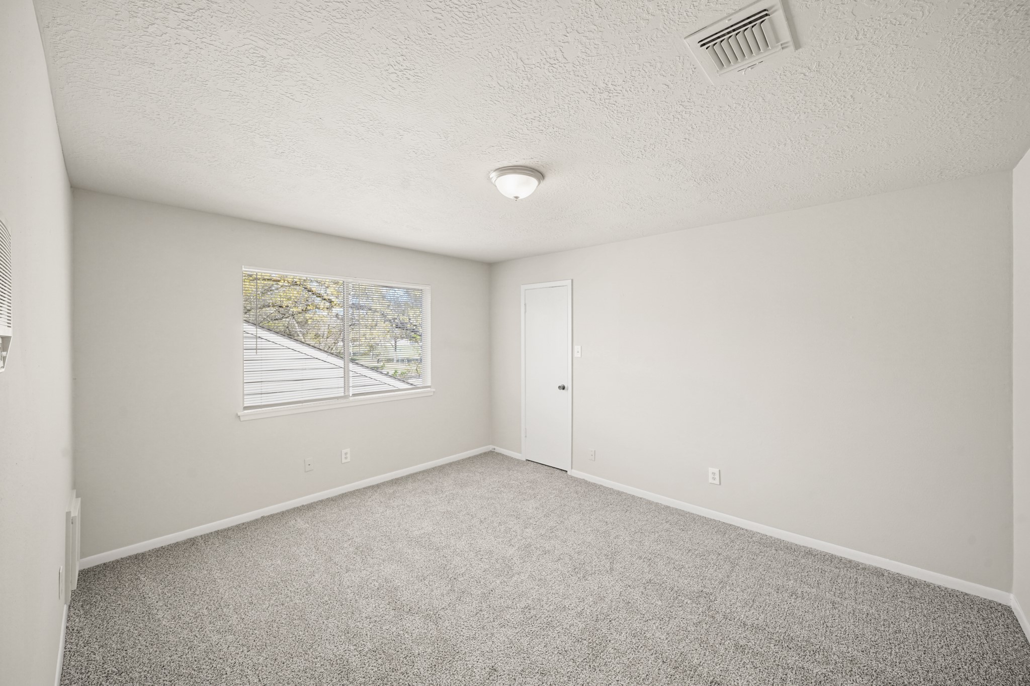 6514 Winkleman Road Houston, TX 77083 - Photo 8 of 15 an empty room with windows