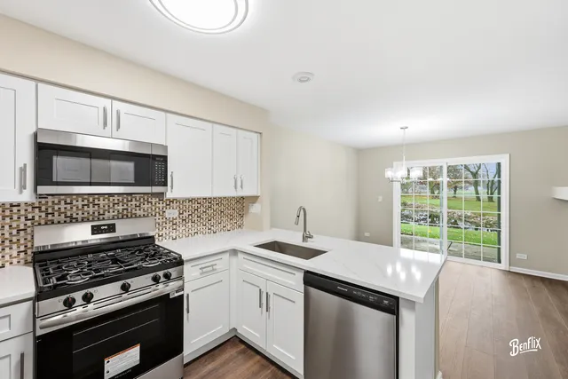 a kitchen with a stove and a microwave