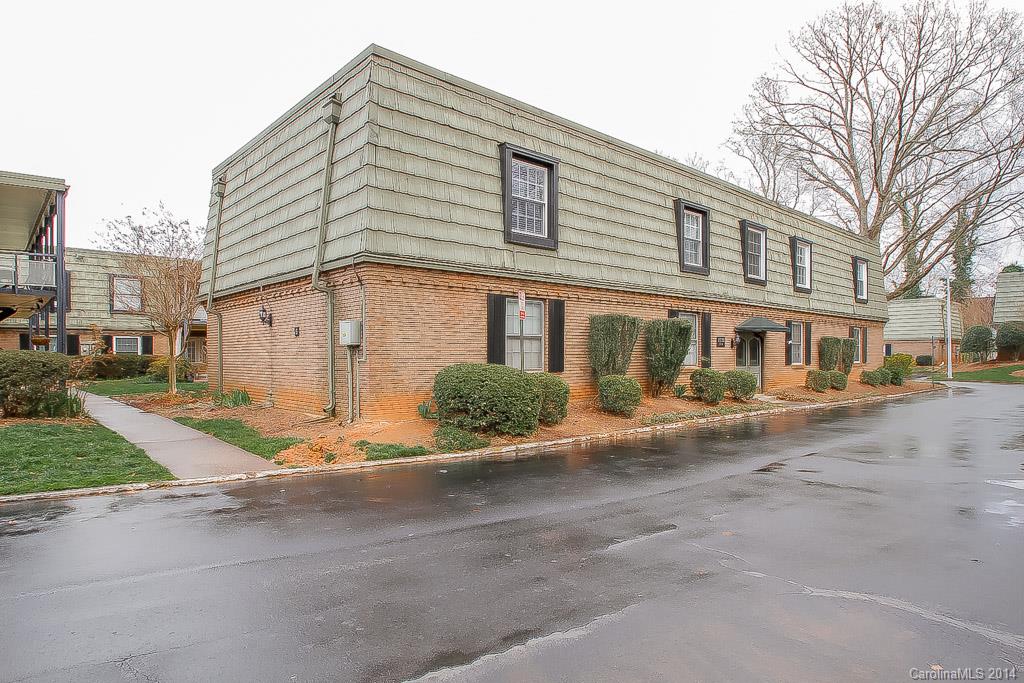 2632 Park Road, Unit H Charlotte, NC 28209 - Photo 1 of 23 a view of a white house next to a road