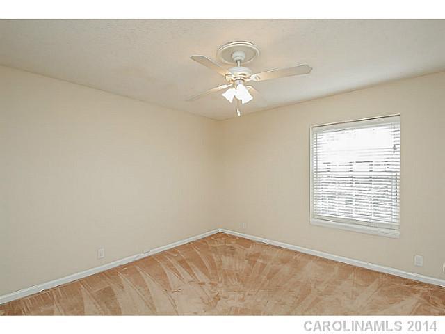2632 Park Road, Unit H Charlotte, NC 28209 - Photo 17 of 23 a view of an empty room with a window