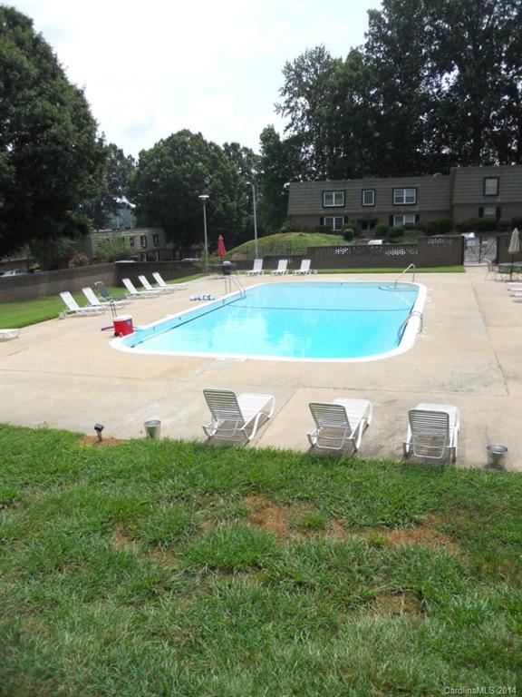 2632 Park Road, Unit H Charlotte, NC 28209 - Photo 23 of 23 a view of a swimming pool with a yard