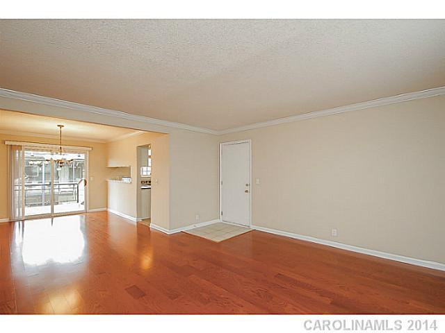 2632 Park Road, Unit H Charlotte, NC 28209 - Photo 4 of 23 a view of empty room with wooden floor and fan