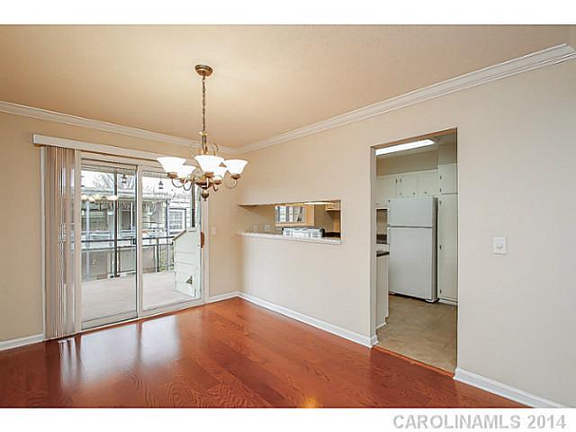 2632 Park Road, Unit H Charlotte, NC 28209 - Photo 7 of 23 a view interior of a house wooden floor and a chandelier
