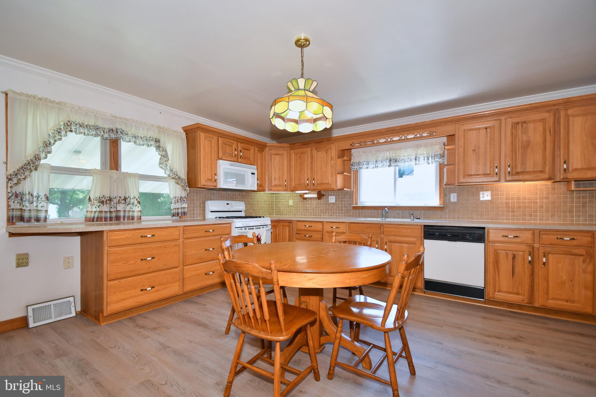 206 Oakwood Road Baltimore, MD 21222 - Photo 4 of 41 Plenty of Cabinetry w/ Tiled Backsplash Surround