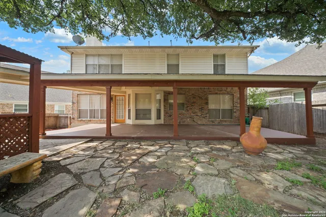 a front view of a house with a large window