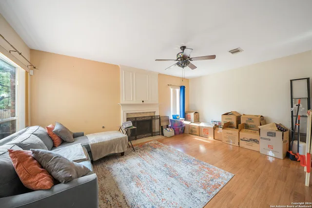 a living room with furniture and a fireplace