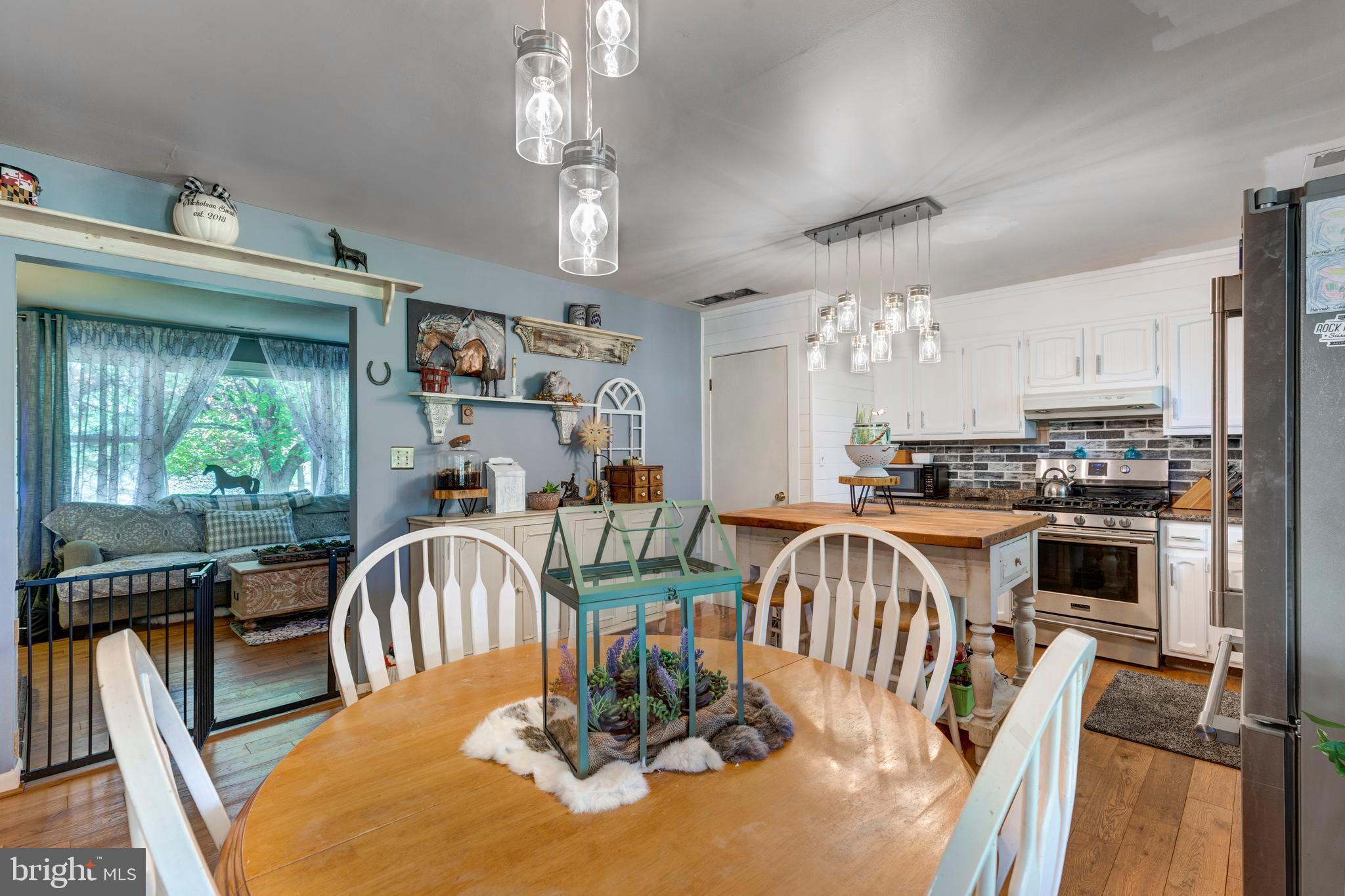 2226 Harney Road Littlestown, PA 17340 - Photo 27 of 131 a view of a dining room with furniture window and outside view