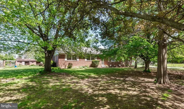 a view of a house with a big yard