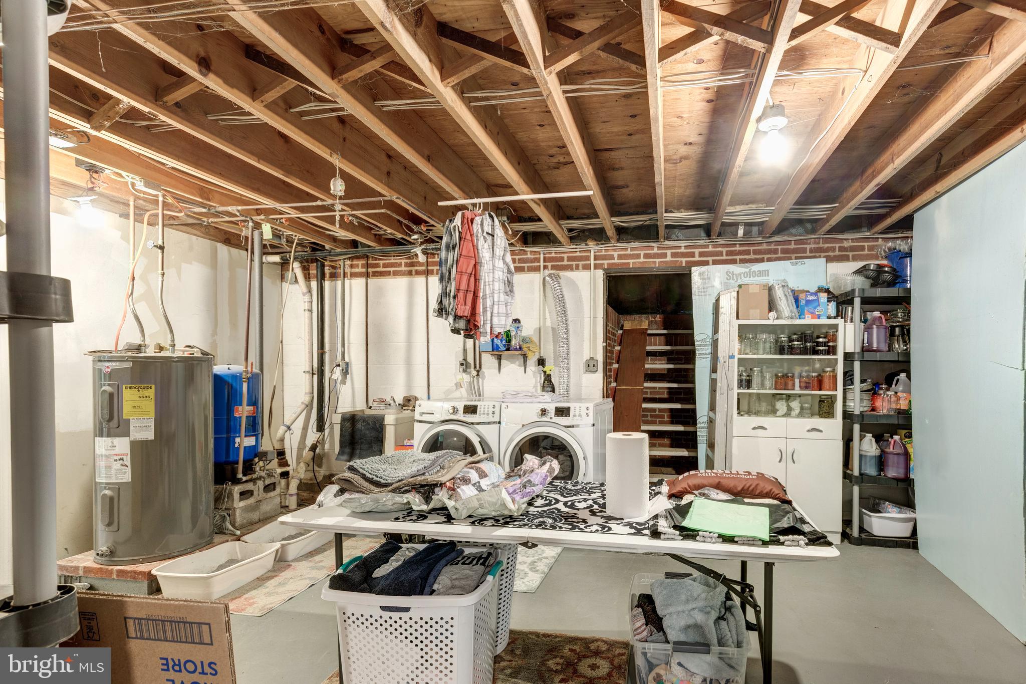 2226 Harney Road Littlestown, PA 17340 - Photo 44 of 131 a room with stainless steel appliances kitchen island granite countertop lots of clutter