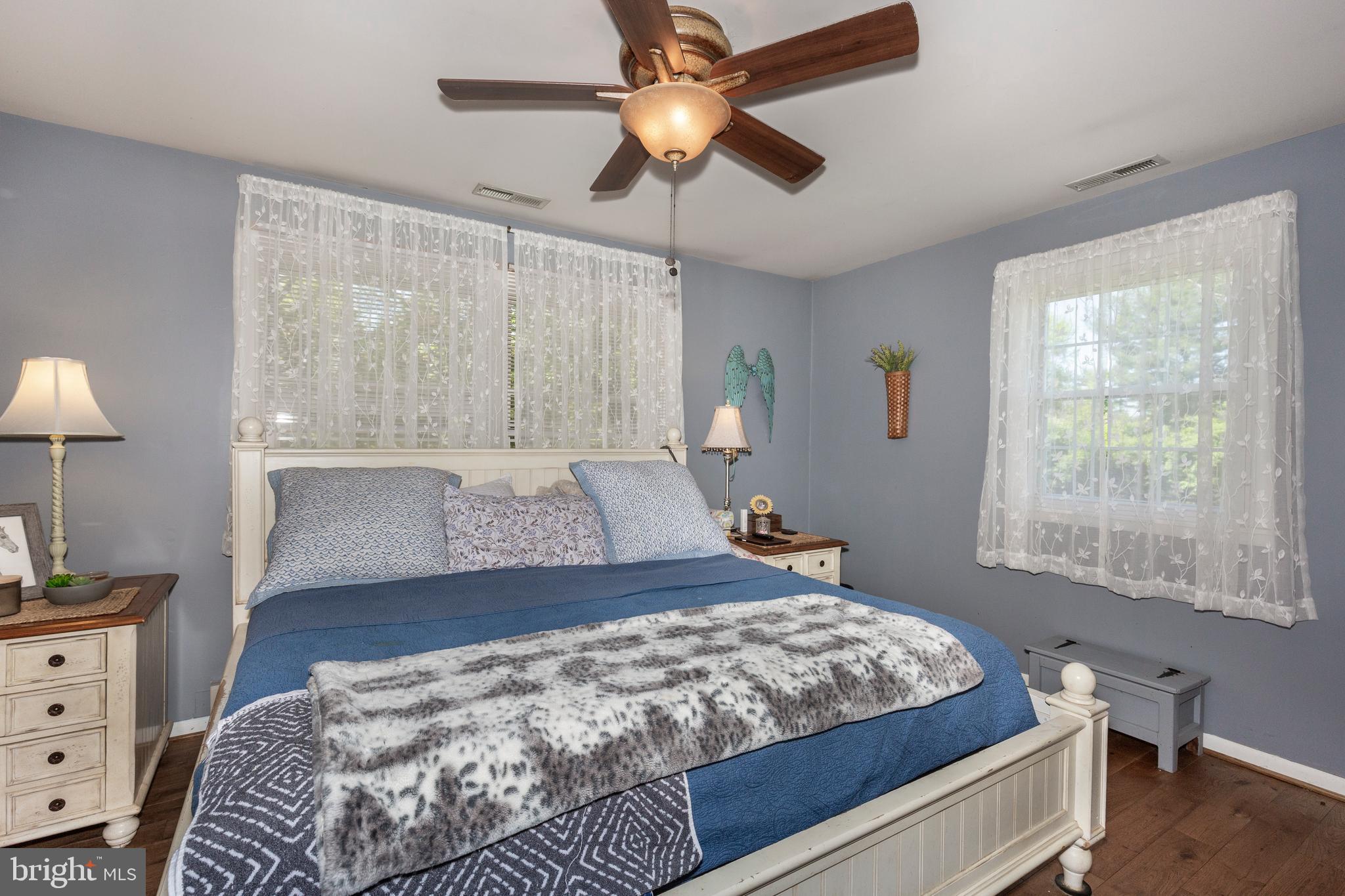 2226 Harney Road Littlestown, PA 17340 - Photo 51 of 131 a bedroom with a large bed and a chandelier