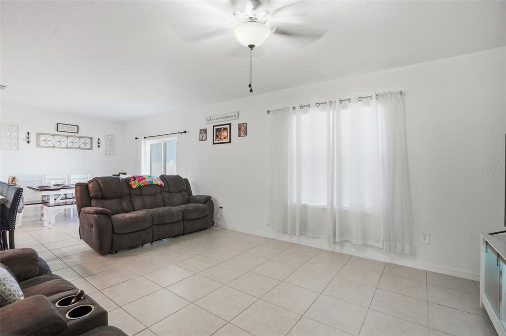 13712 Newbridge Street Spring Hill, FL 34609 - Photo 13 of 35 a living room with furniture and a window