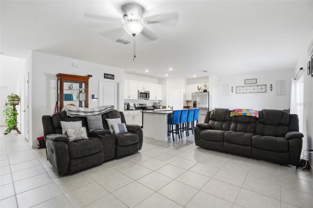 13712 Newbridge Street Spring Hill, FL 34609 - Photo 14 of 35 a living room with furniture and a view of kitchen