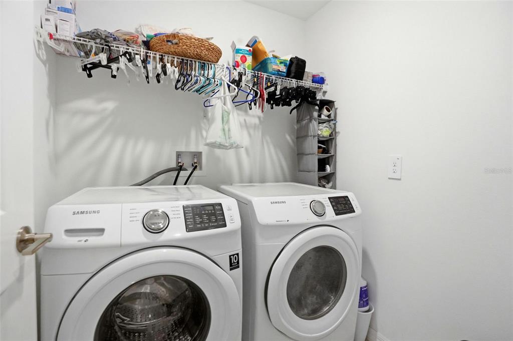 13712 Newbridge Street Spring Hill, FL 34609 - Photo 24 of 35 a utility room with dryer and washer