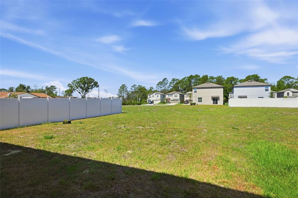 13712 Newbridge Street Spring Hill, FL 34609 - Photo 31 of 35 a view of an outdoor space and yard