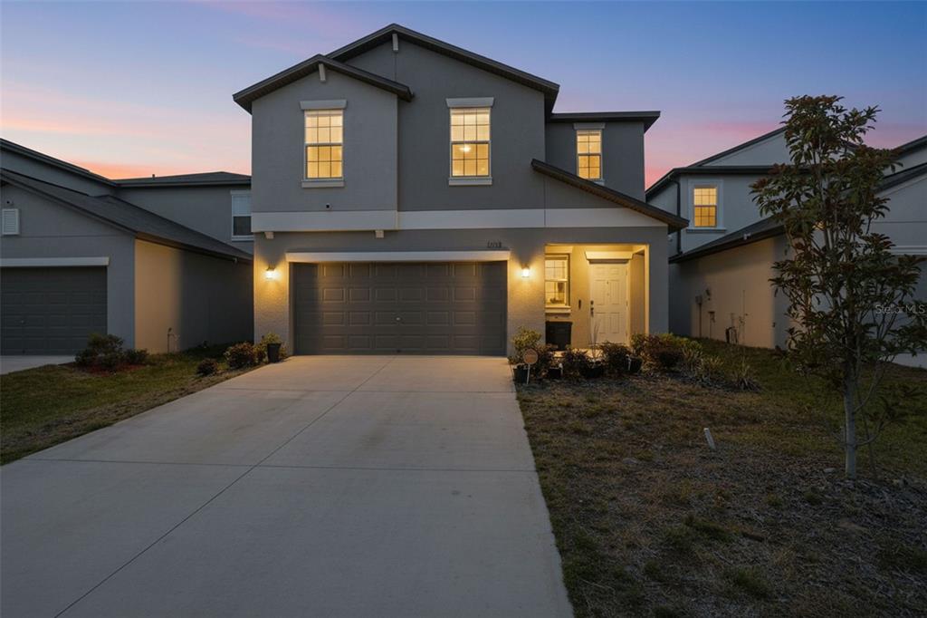 13712 Newbridge Street Spring Hill, FL 34609 - Photo 32 of 35 a front view of a house with a yard