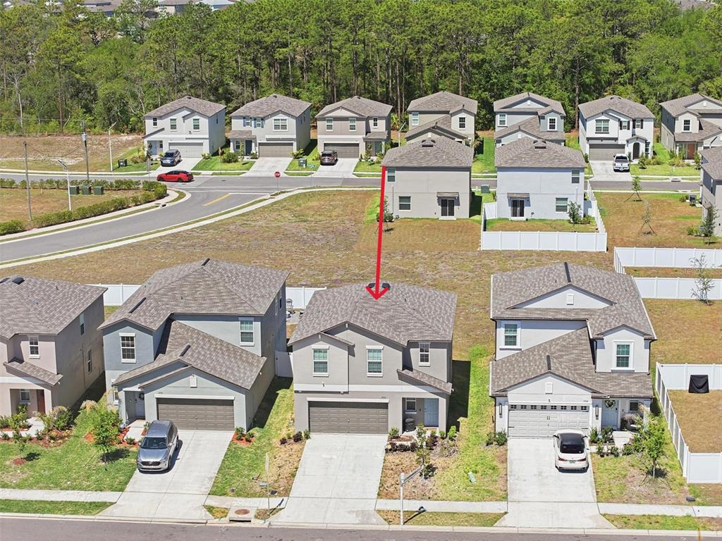 13712 Newbridge Street Spring Hill, FL 34609 - Photo 33 of 35 an aerial view of residential houses with outdoor space