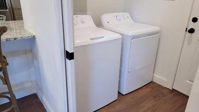 a utility room with dryer and washer