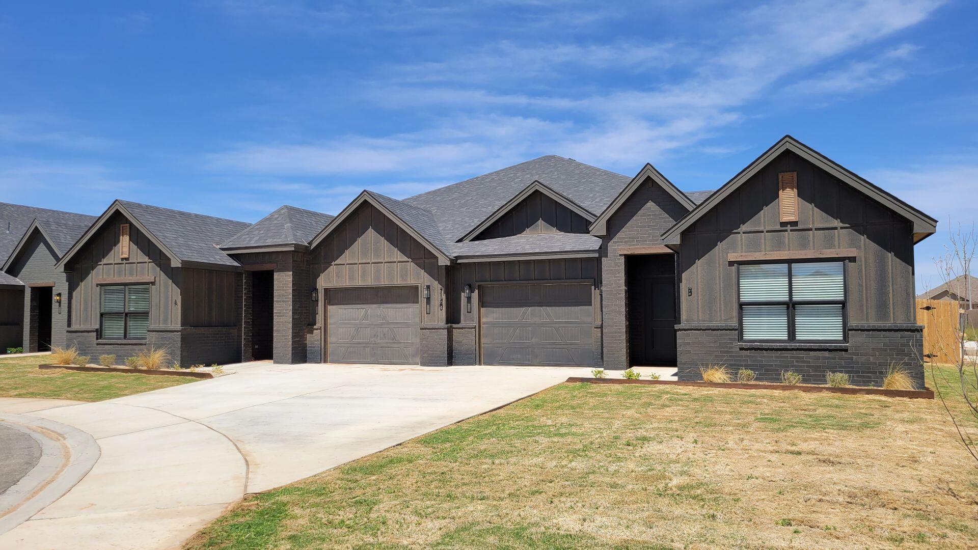 7120 22nd Street Lubbock, TX 79407 - Photo 2 of 40 a view of a house with a yard and large tree