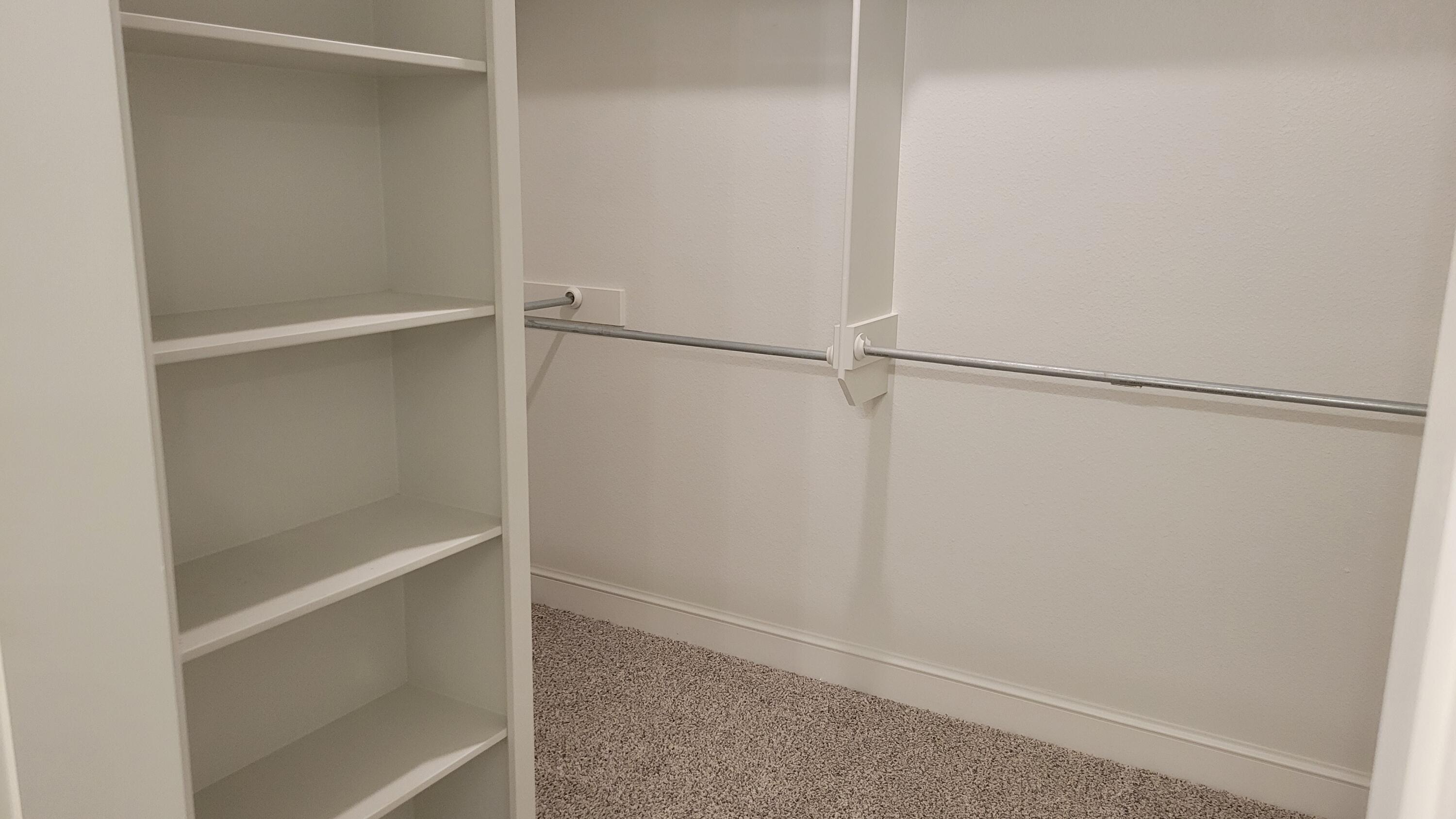 7120 22nd Street Lubbock, TX 79407 - Photo 25 of 40 a view of an empty walk in closet