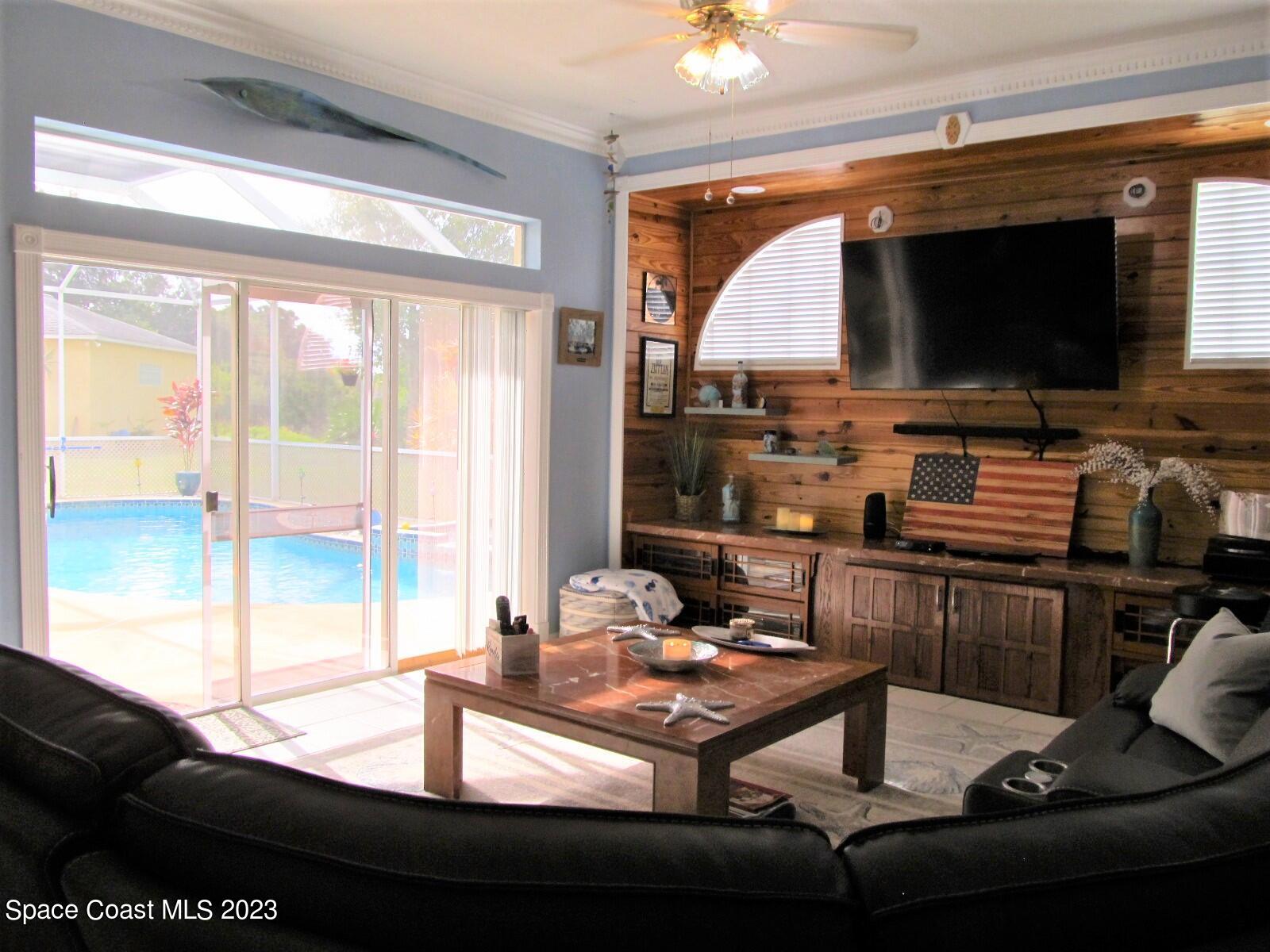 600 Roth Court Southeast Palm Bay, FL 32909 - Photo 13 of 53 Family Room View to Pool