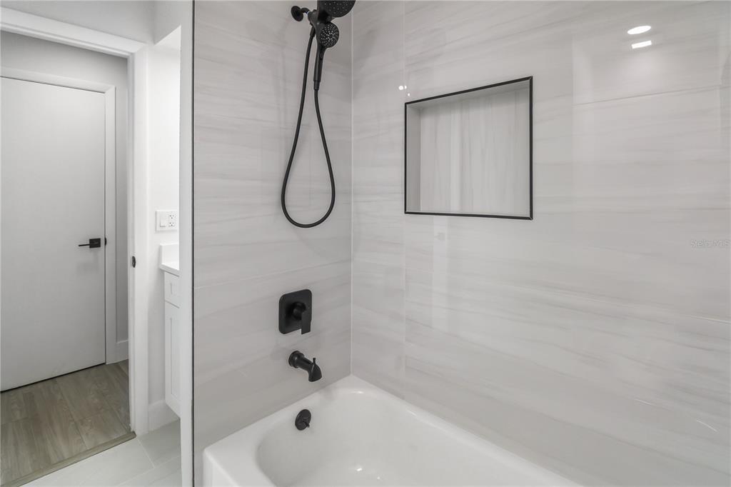 11492 93rd Street Largo, FL 33773 - Photo 23 of 37 a bathroom with a bathtub