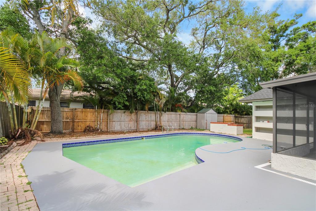 11492 93rd Street Largo, FL 33773 - Photo 29 of 37 a view of a backyard with swimming pool