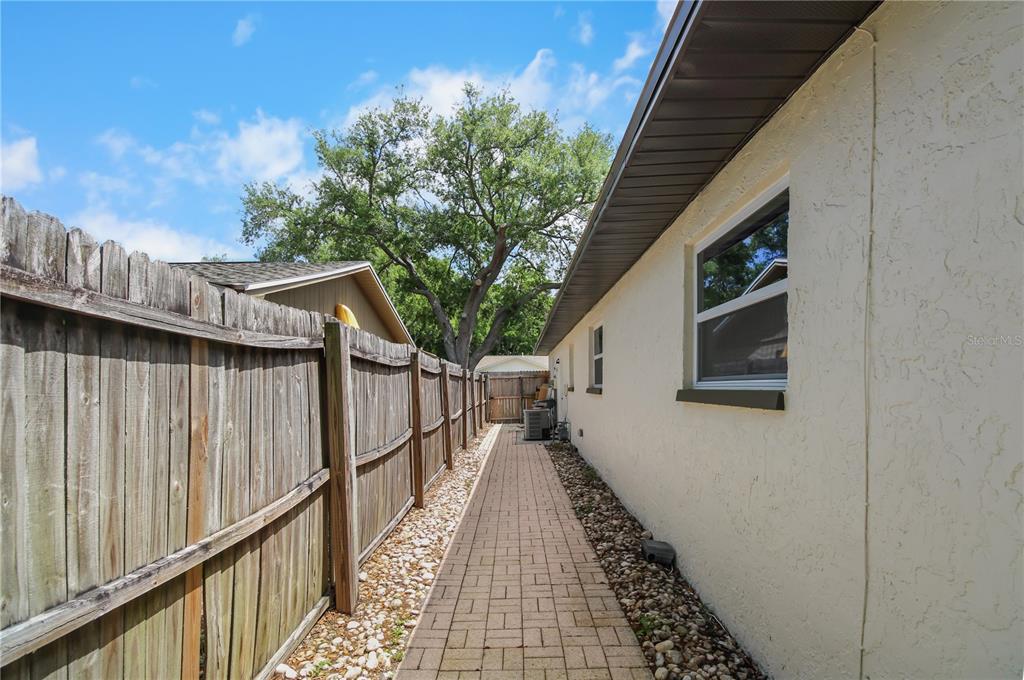 11492 93rd Street Largo, FL 33773 - Photo 33 of 37 a view of a pathway of a house with wooden floor