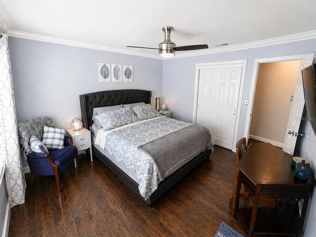 2313 Southeast 7th Street Ocala, FL 34471 - Photo 13 of 54 a bedroom with a bed a dresser and chair