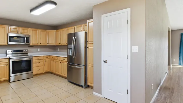 a kitchen with a sink cabinets and window