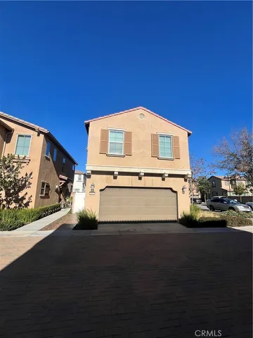 a view of a street with big house