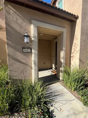 a kitchen with a sink and wooden floor