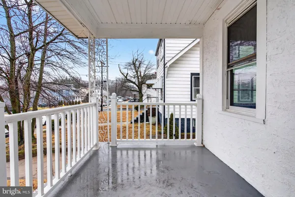 a view of a balcony with wooden floor
