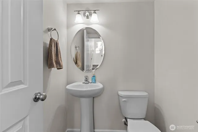 a living room with dining room and wooden floor