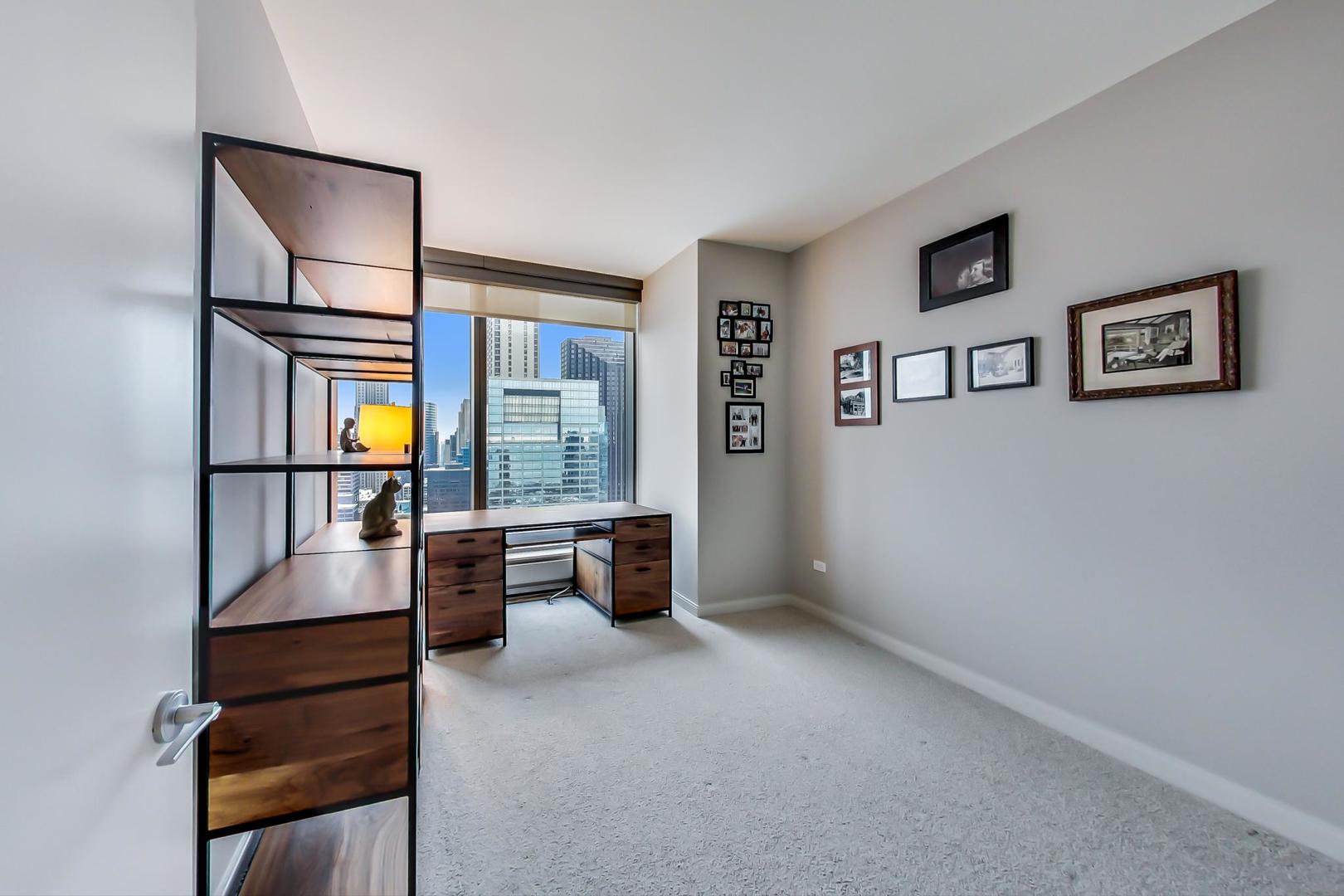 60 East Monroe Street, Unit 4404 Chicago, IL 60603 - Photo 15 of 34 a living room with furniture and a window