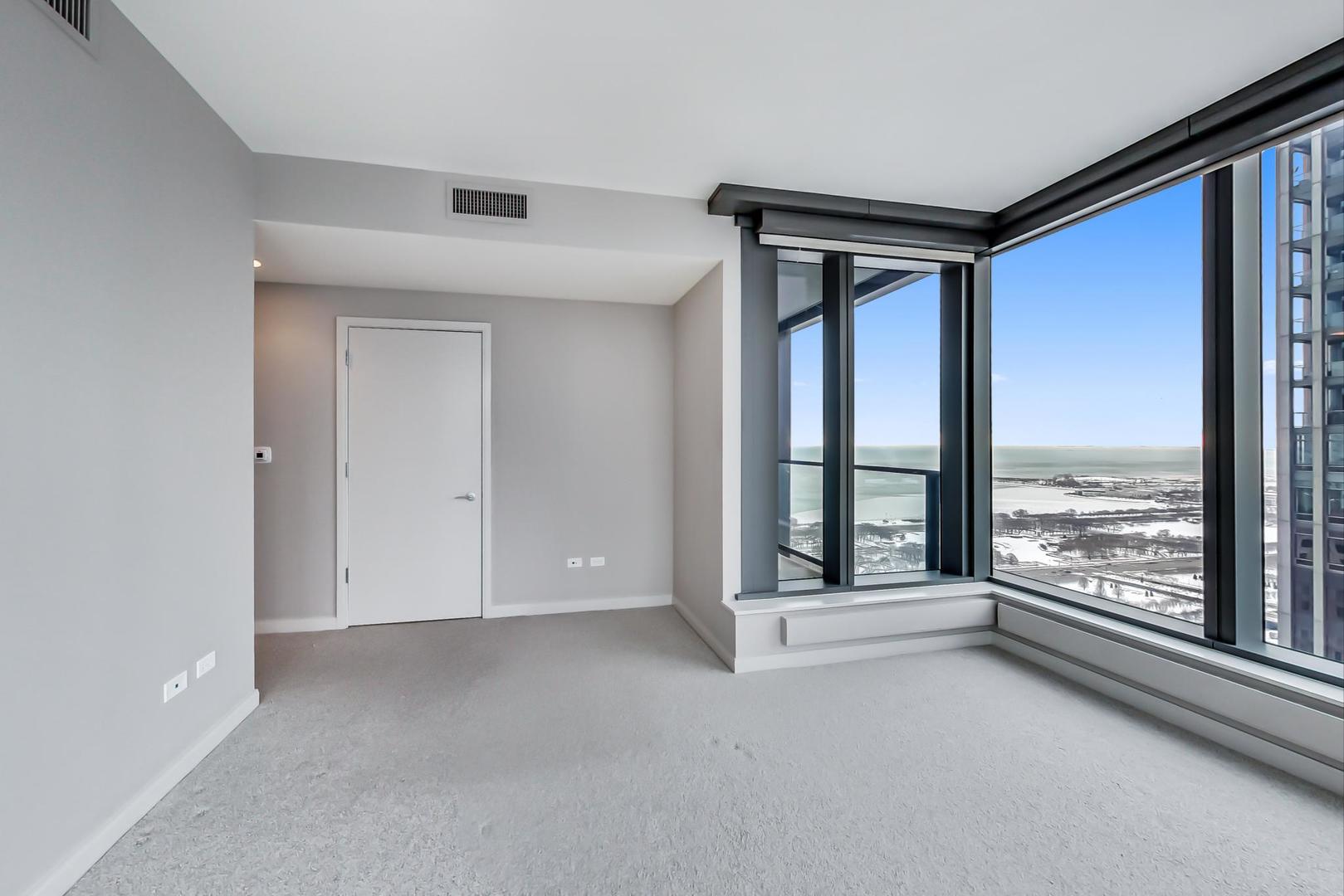 60 East Monroe Street, Unit 4404 Chicago, IL 60603 - Photo 25 of 34 a view of an empty room and window