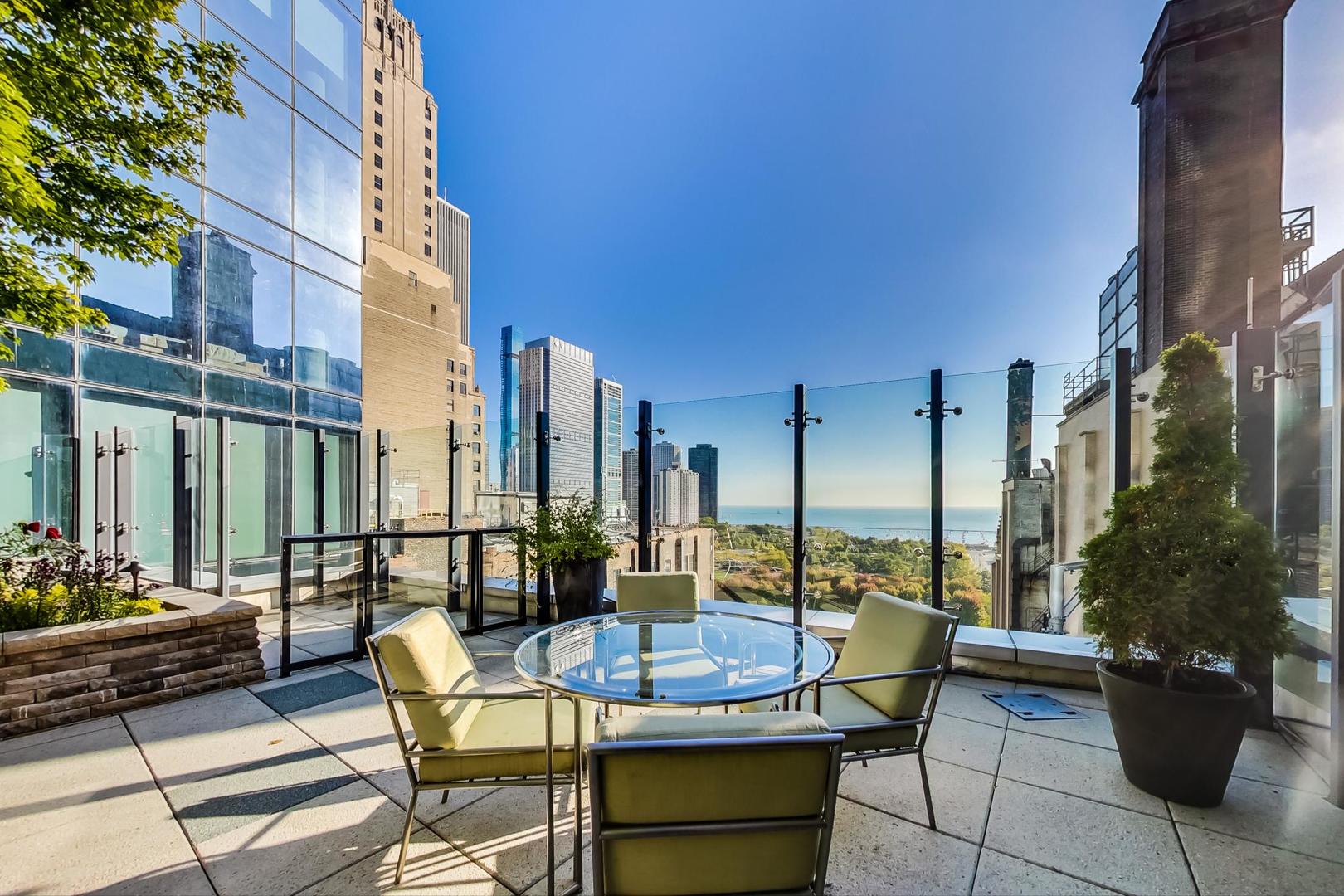 60 East Monroe Street, Unit 4404 Chicago, IL 60603 - Photo 27 of 34 a view of a patio with couches and potted plants