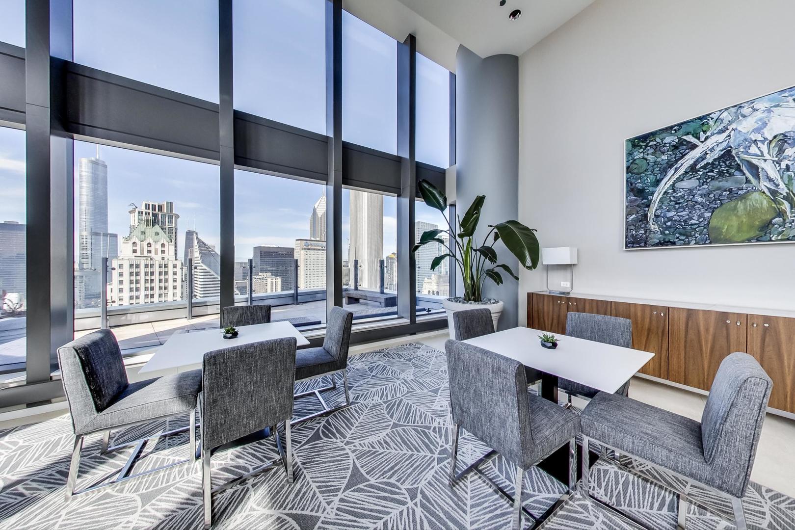 60 East Monroe Street, Unit 4404 Chicago, IL 60603 - Photo 30 of 34 a living room with furniture and floor to ceiling windows