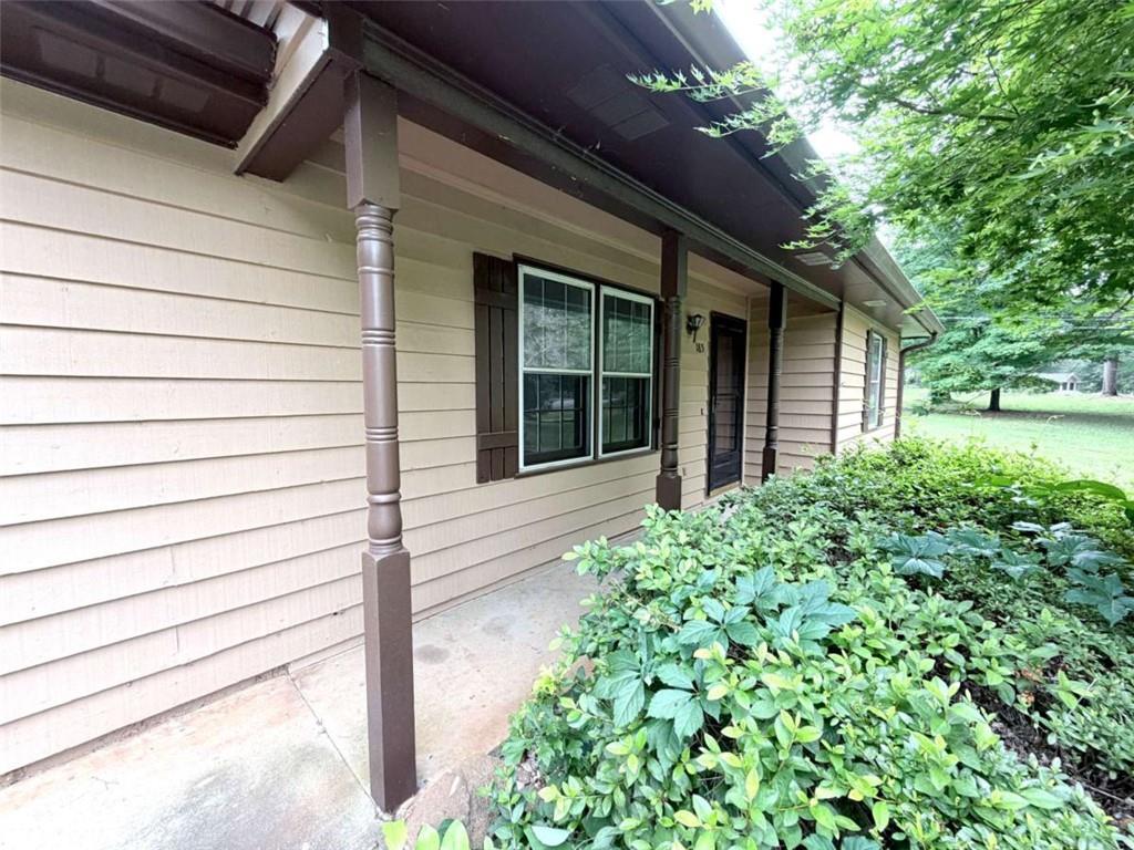 185 Roberts Road Covington, GA 30016 - Photo 6 of 25 a front view of a house with garden