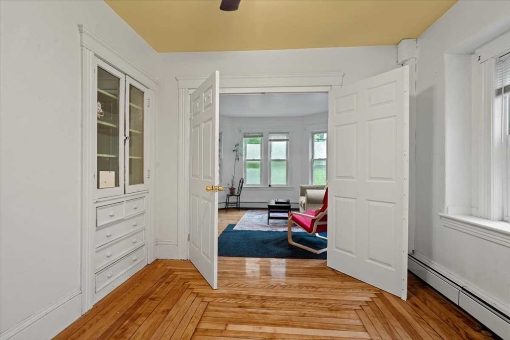 3 Wallace Street Worcester, MA 01605 - Photo 9 of 29 a view of a bedroom with wooden floor and furniture