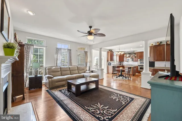 a living room with furniture fireplace and a flat screen tv