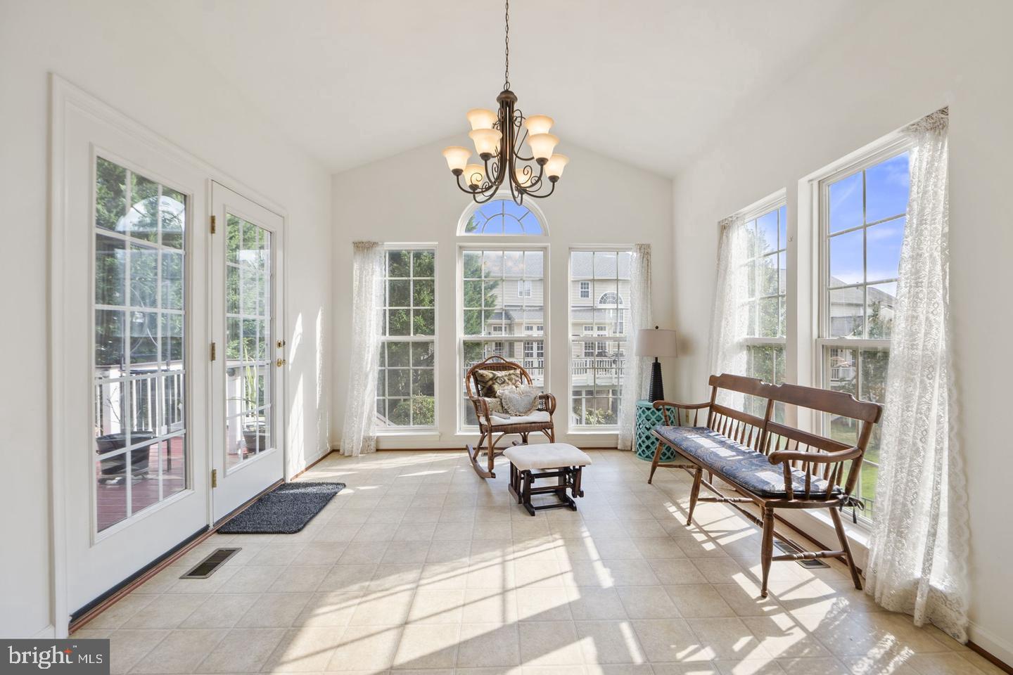 6528 Atkins Way Gainesville, VA 20155 - Photo 15 of 42 a living room with furniture and a large window