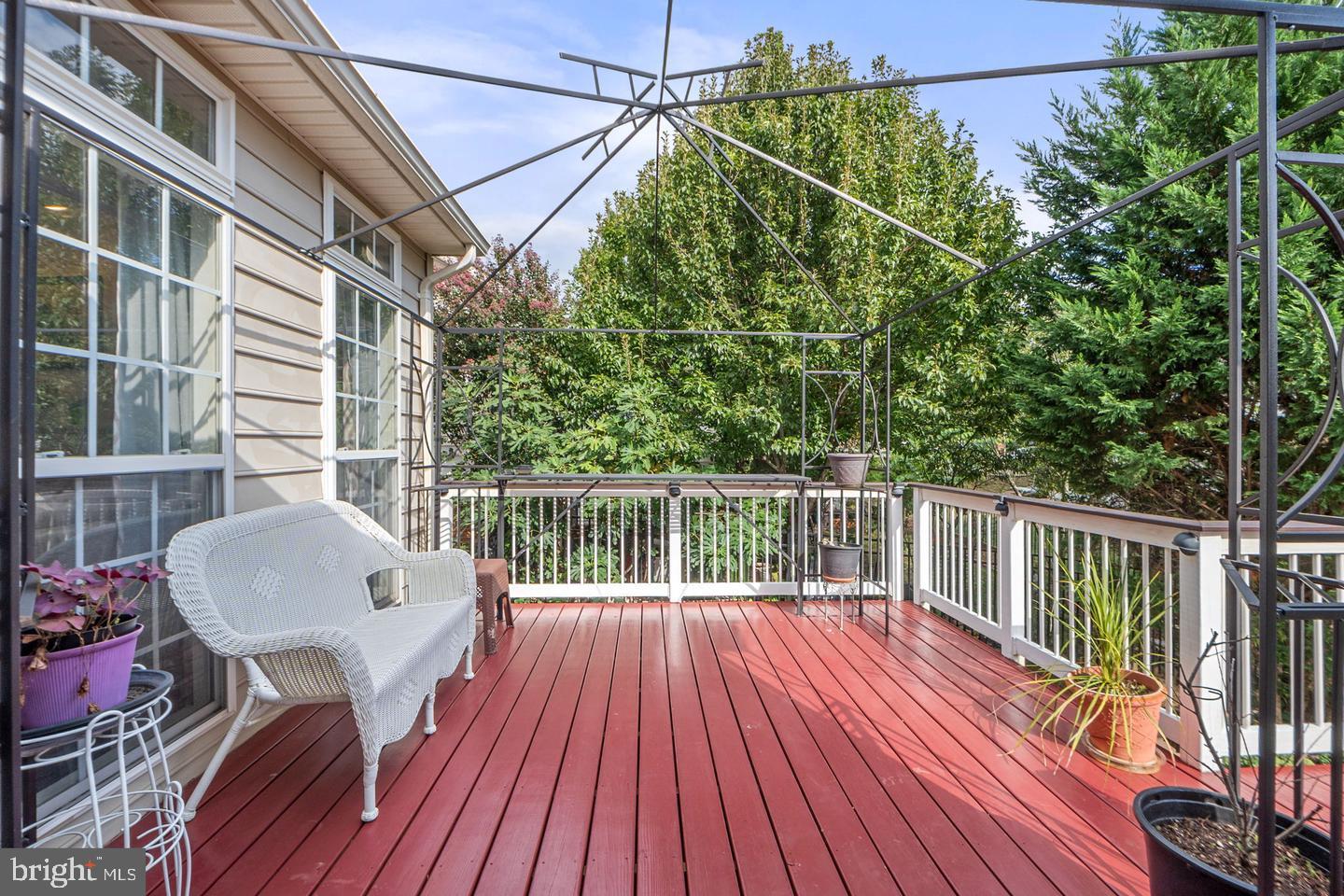 6528 Atkins Way Gainesville, VA 20155 - Photo 17 of 42 a view of balcony with wooden floor and outdoor seating