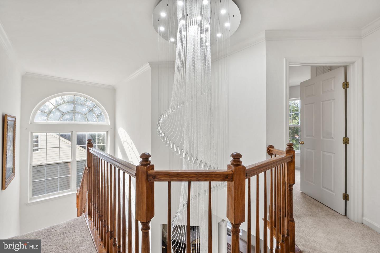 6528 Atkins Way Gainesville, VA 20155 - Photo 19 of 42 a view of a hallway view with floor to ceiling window and a chandelier