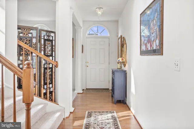 a view of an entryway with wooden floor