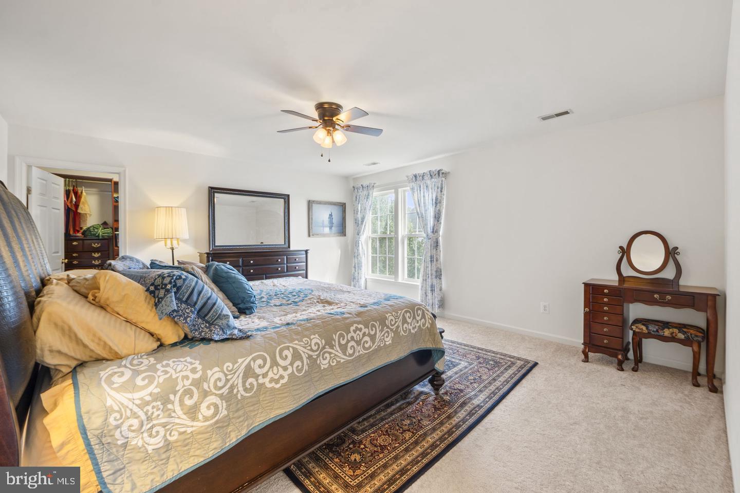 6528 Atkins Way Gainesville, VA 20155 - Photo 21 of 42 a bed room with a bed and a chandelier