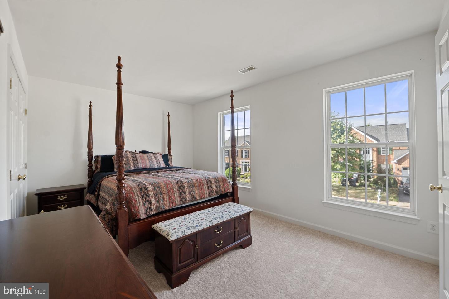 6528 Atkins Way Gainesville, VA 20155 - Photo 27 of 42 a bedroom with a bed window and couch
