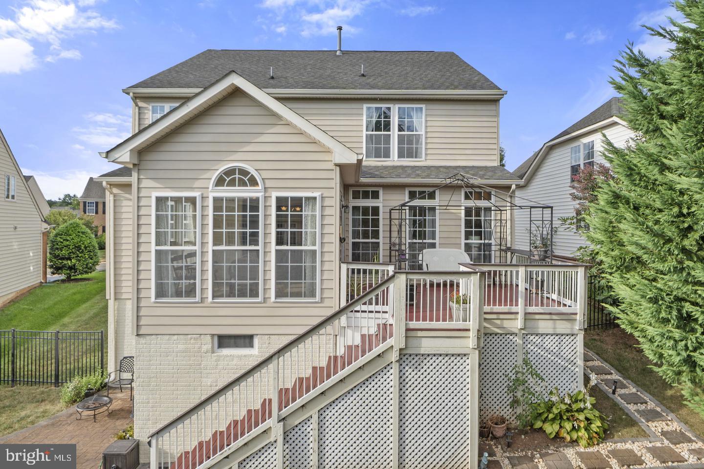 6528 Atkins Way Gainesville, VA 20155 - Photo 38 of 42 a view of a house with a yard